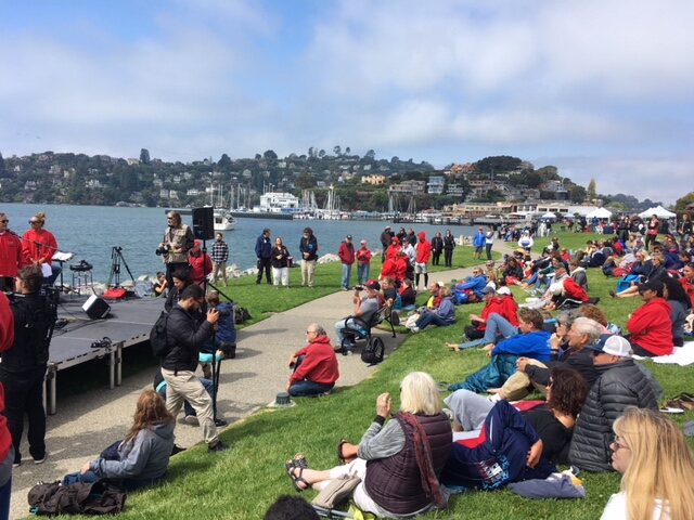 People gathered on the lawn of the Tiburon waterfront park
